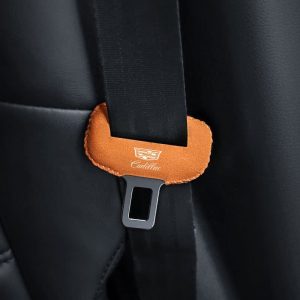 Suede material close-up of Cadillac seat belt buckle cover